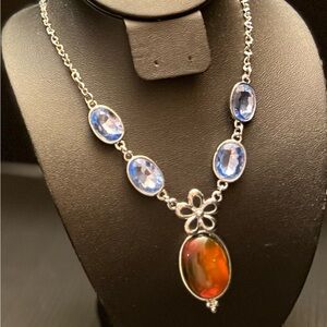 Elegant Silver Toned Necklace with Vibrant Blue and Amber like-gemstones